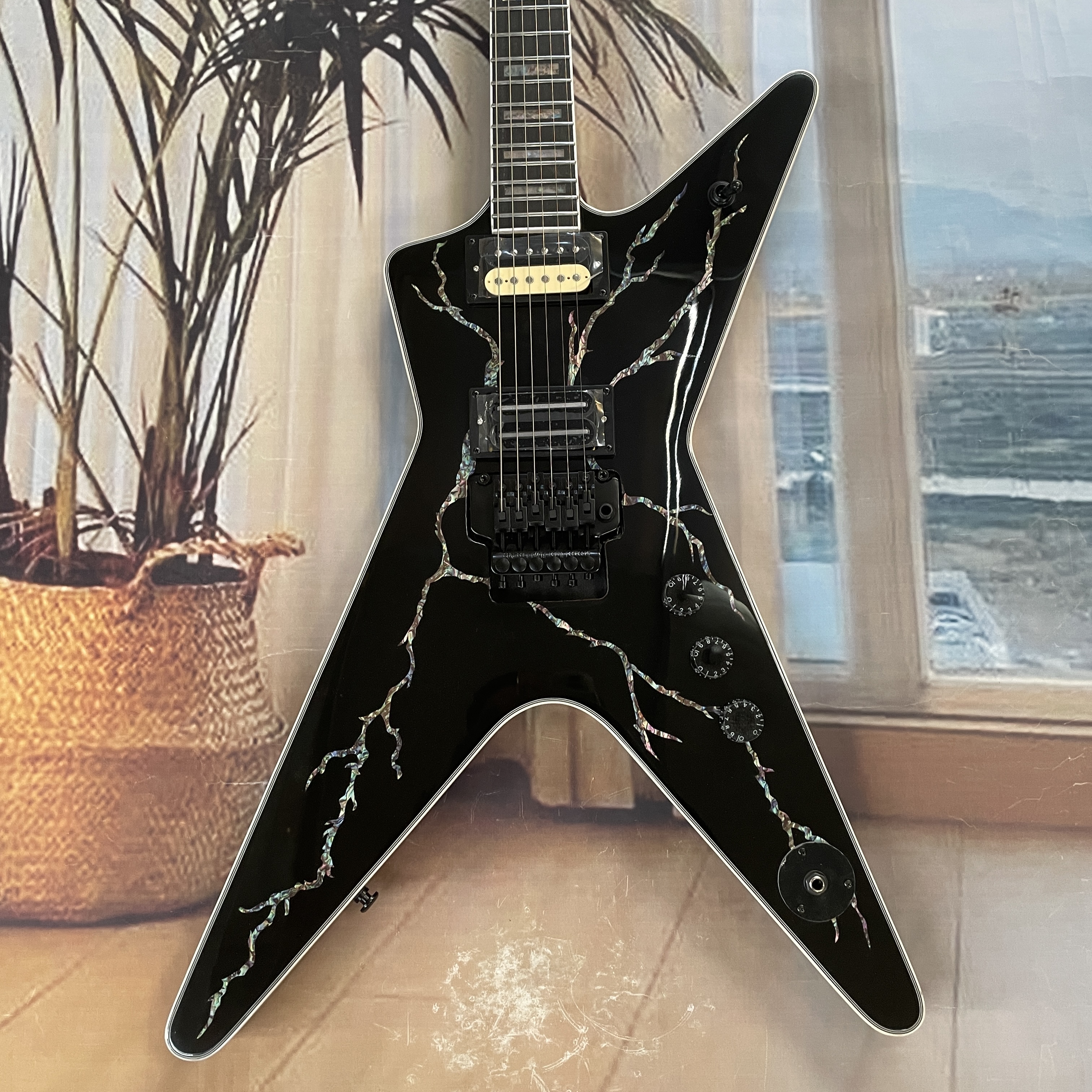 Electric Guitar Beginner - 6-string black lightningshaped electric guitar with